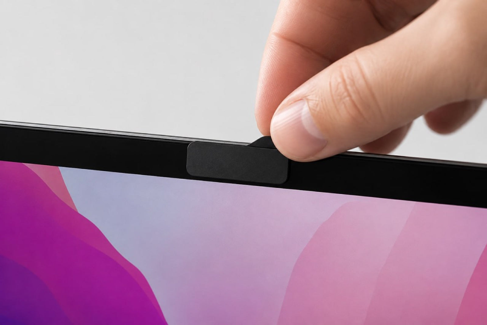 Lifting the 1.2 mm tab with a fingernail